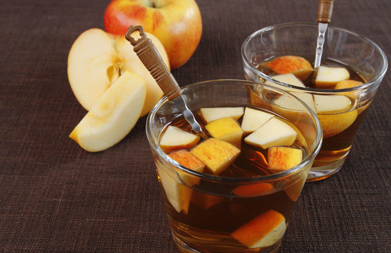 Two glasses of punch with apples