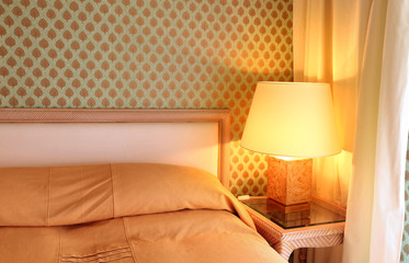 interior luxury apartment, comfortable bedroom, table lamp