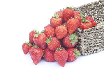 Fresh ripe juicy strawberries in rustic basket isolated on white