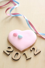 2012 and heart shaped cookie for new year image