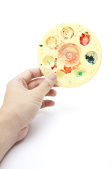 water color, a male hand holding water color pad.