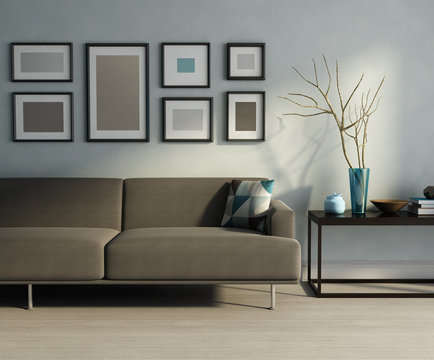 Modern interior, biege sofa, frames and a table