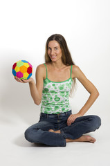 Beautiful woman holding a ball