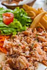 Fresh salmon salad with tomatoes