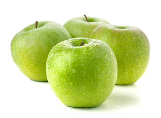 Four ripe green apples