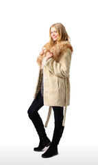 Young beautiful woman in a fur coat