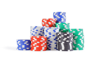 Stacks of poker chips including red, black, white, green