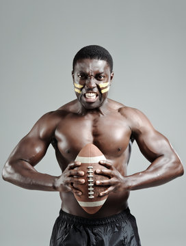 Muscular american football player