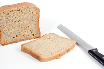 wheat bread with knife isolated on white