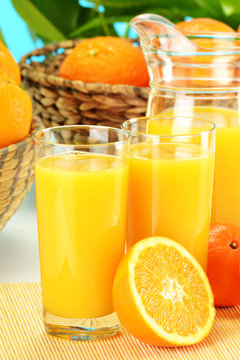 Composition with two glasses of orange juice and fruits