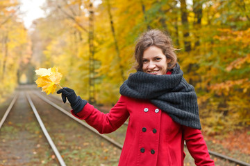 Smiling woman in autumn park