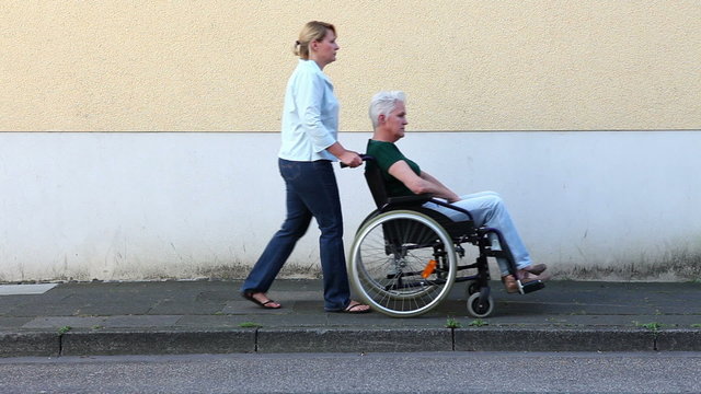 Nurse driving disabled woman