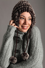 Young girl warm for winter in wool sweater and hat