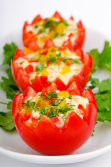 Russian salad served in tomatoes