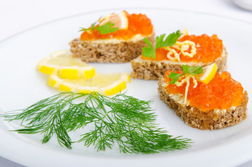 Red caviar served on bread