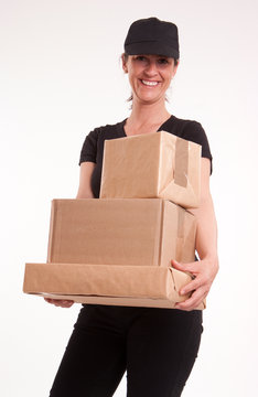 Smiling delivery woman in black