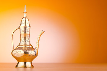 Ancient lamp against gradient background
