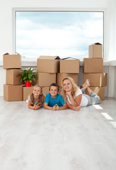 Happy woman and kids in their new home