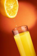 Orange juice pouring