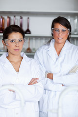 Portrait of female science students posing