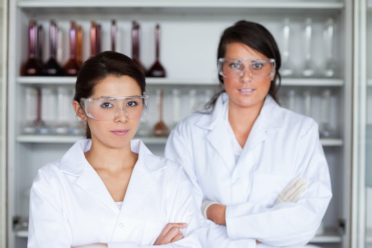 Serious female scientists posing