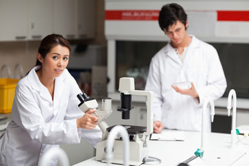 Fototapeta premium Good looking science students making experiments