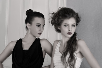 Fototapeta premium girls in black and white dresses with amazing poses