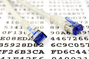 Network patch cable against a sheet with an encryption key