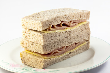 cheese and ham sandwich on plate