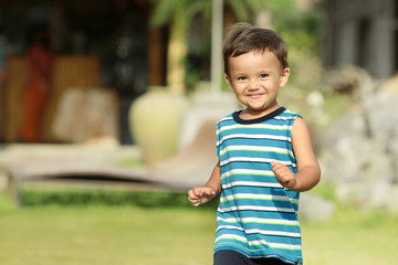 young kid running and smiling