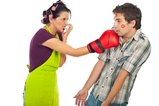 Angry housewife boxing her drunk unfaithful man