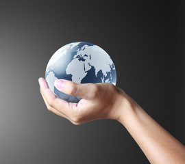 holding a glowing earth globe in his hands