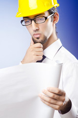 Young engineer looking at drawings