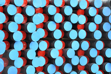 Stock gray plastic pipes with red and blue caps