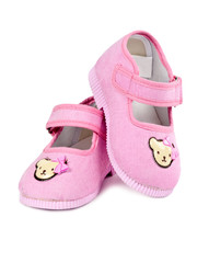 a pair of baby pink shoes