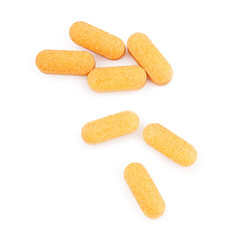 Orange medical pills isolated on white