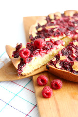 homemade sweet raspberry pie on cutting board