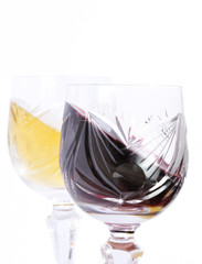Glasses of red and white wine isolated in white