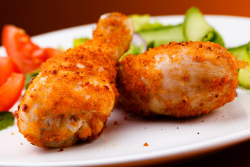 Roasted chicken drumsticks and vegetables