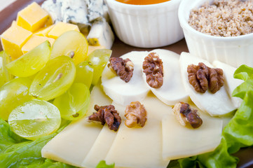 Arrangement ofcheese,grape, nuts