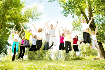 large group of teens jumping together