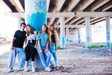 Teenagers standing at the column