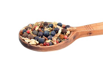 Spice mix in wooden spoon, isolated on white background
