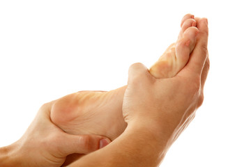 massage foot female close-up isolated on white