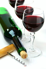 Bottle of wine, glasses and a corkscrew.