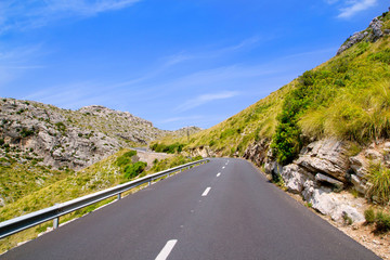 Fototapeta premium curve of road in mountain with Pollensa view in Mallorca