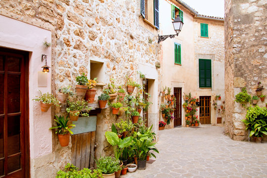 Fototapeta Majorca Valldemossa typical with flower pots in facade