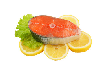 Salmon steak with greens and lemon isolated