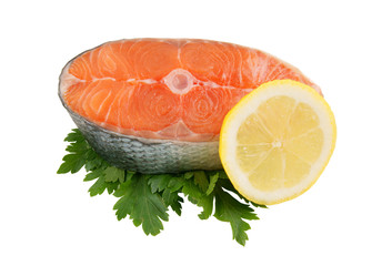 Salmon steak with greens and lemon isolated