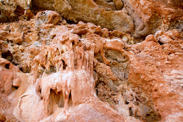 Cave outdoors in Majorca island with red stalactites